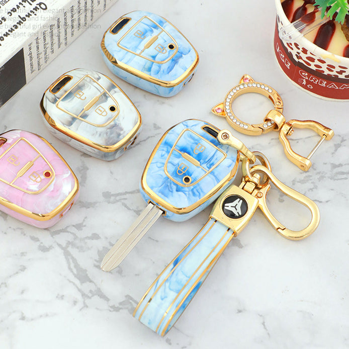 Isuzu Autoschlüsseletui, goldfarben mit Jade-Einlage