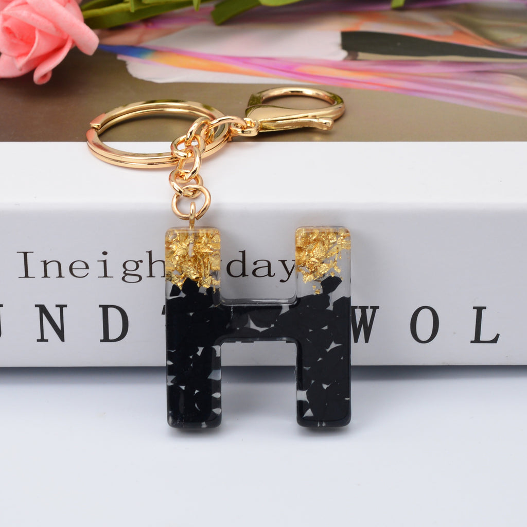 Carsine Black Pompom 26 Alphabets Keychain gold / H